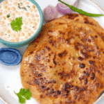 Lauki Paratha Recipe: घर में मौजूद बेसिक सामग्री से कुछ ही मिनट में बनाएं लौकी पराठा